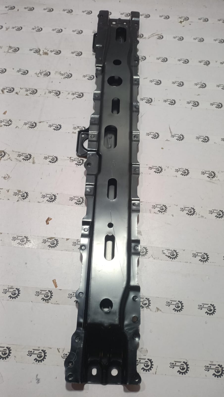 Maruti CarTrends front lower cross member for S-Presso new model, showing the metal component with mounting points