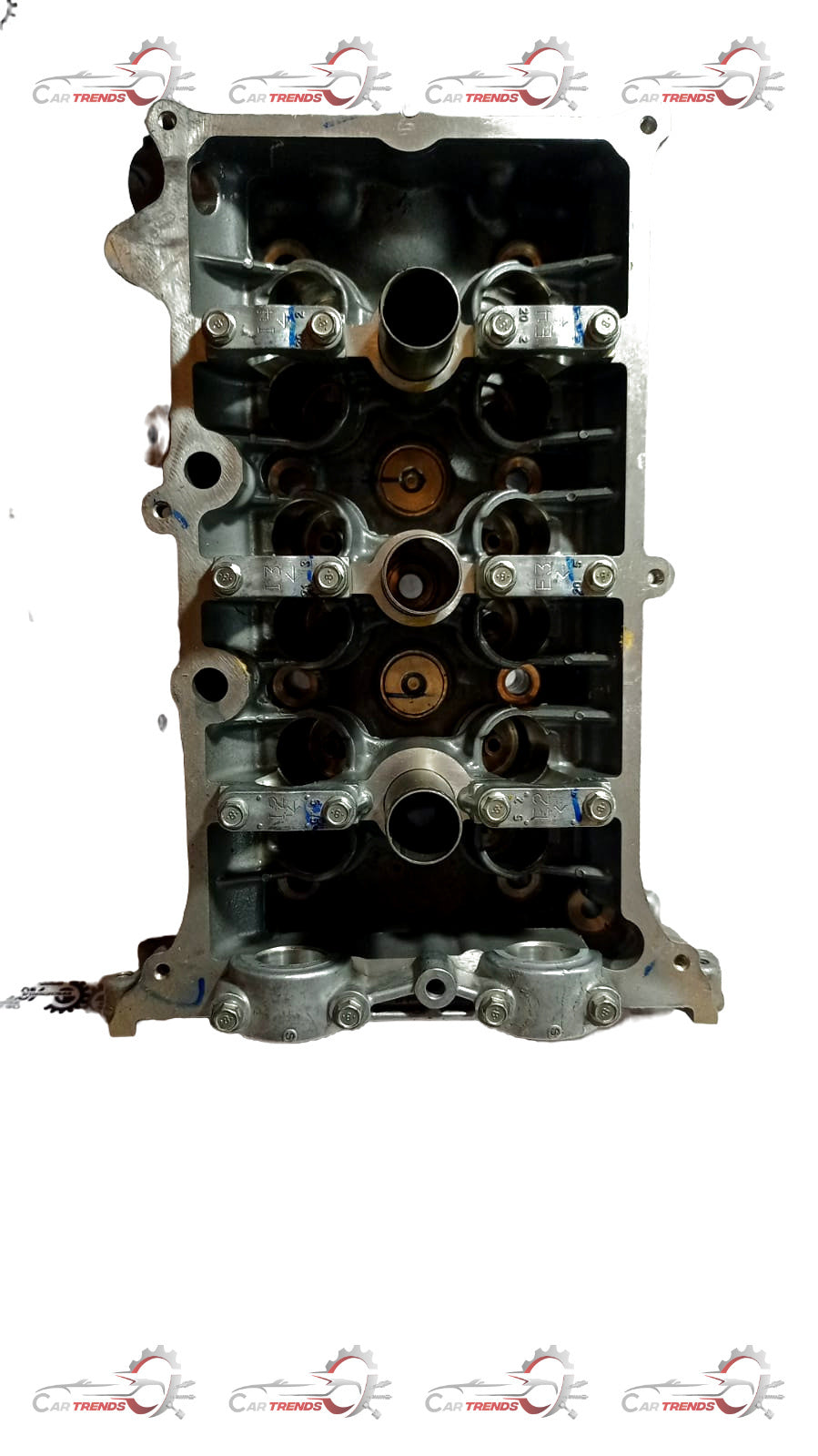 Maruti CarTrends cylinder head Spresso 11100M62SG0, automotive engine component in a clean workshop setting