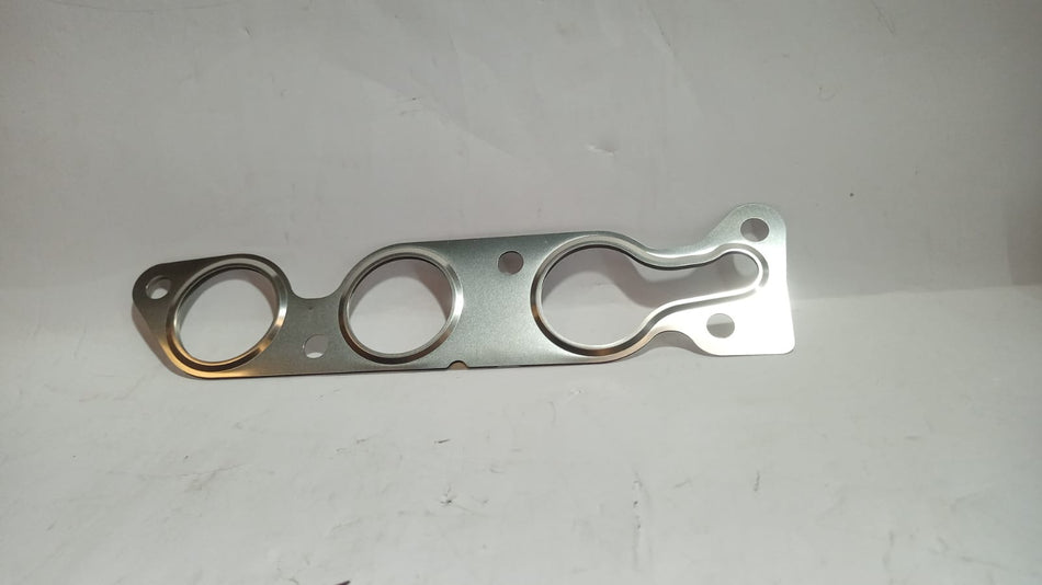 Maruti Gasket Exhaust A-Star by CarTrends, close-up view showing the black rubber gasket for exhaust system replacement.