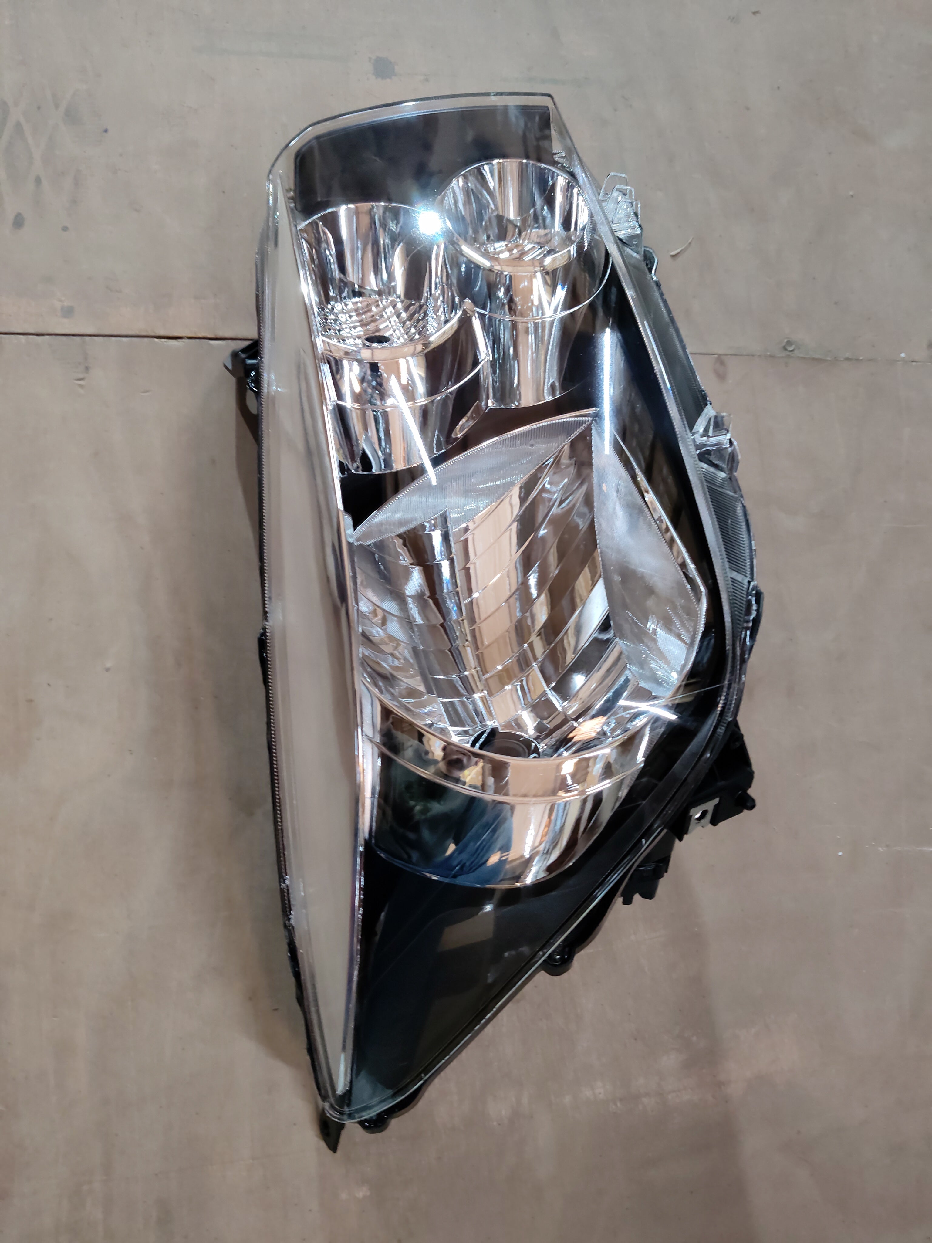 Right side headlamp for Celerio car, CarTrends spare part model 35121M76M00, showing the vehicle's headlight assembly.