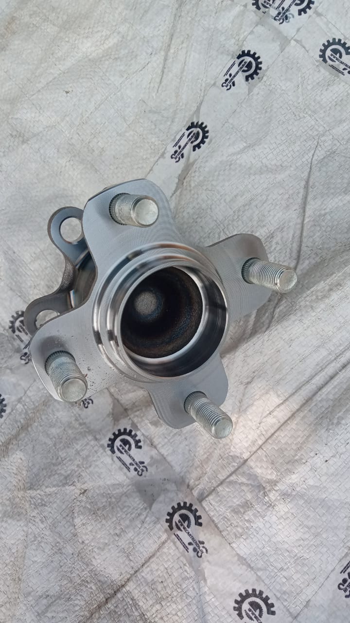 Maruti CarTrends rear wheel hub for Celerio new model, showing the metallic hub with mounting holes and central bore.