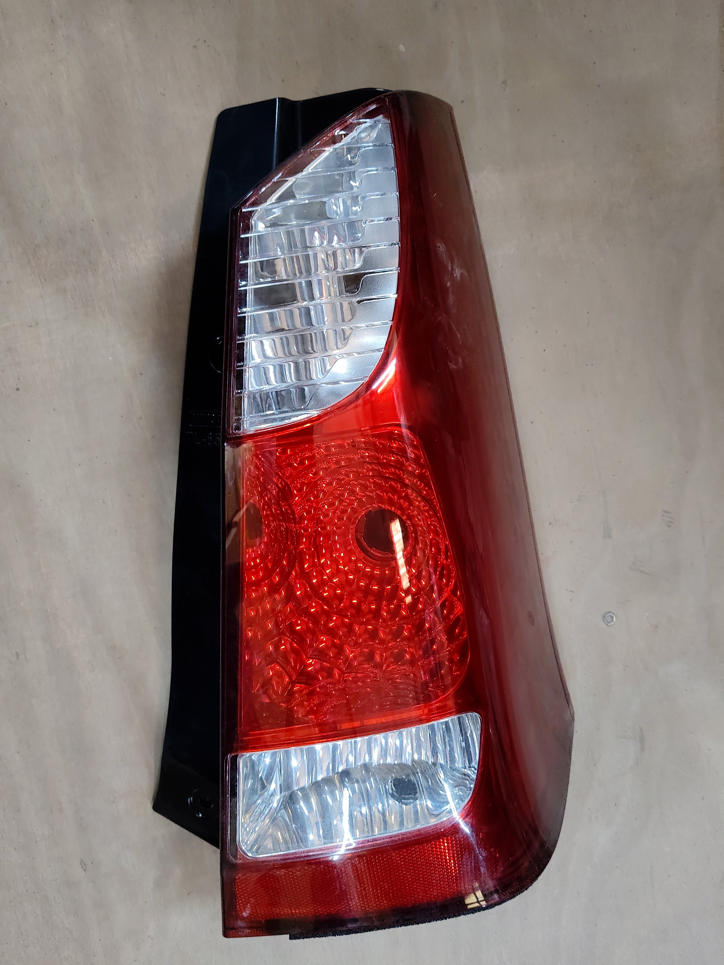 Right side tail lamp for WagonR K series by CarTrends, spare part with clear lens and mounting points.