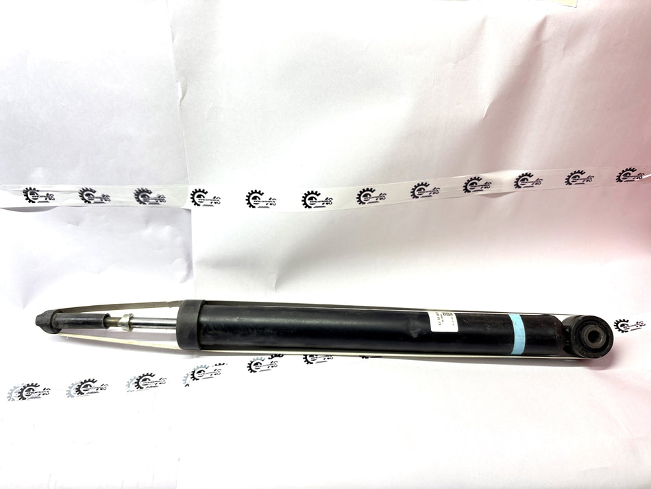 CarTrends shock absorber showing a close-up of the durable metal coil and mounting components for vehicle suspension.