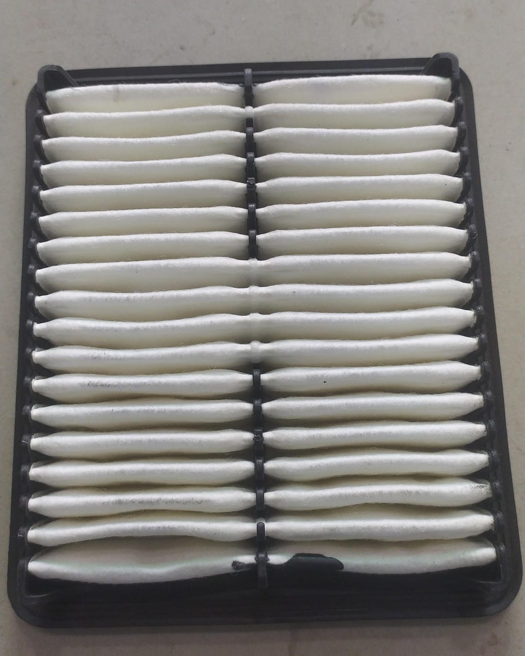 CarTrends Hyundai EON air filter, spare part for engine filtration, with pleated design and brand logo visible.