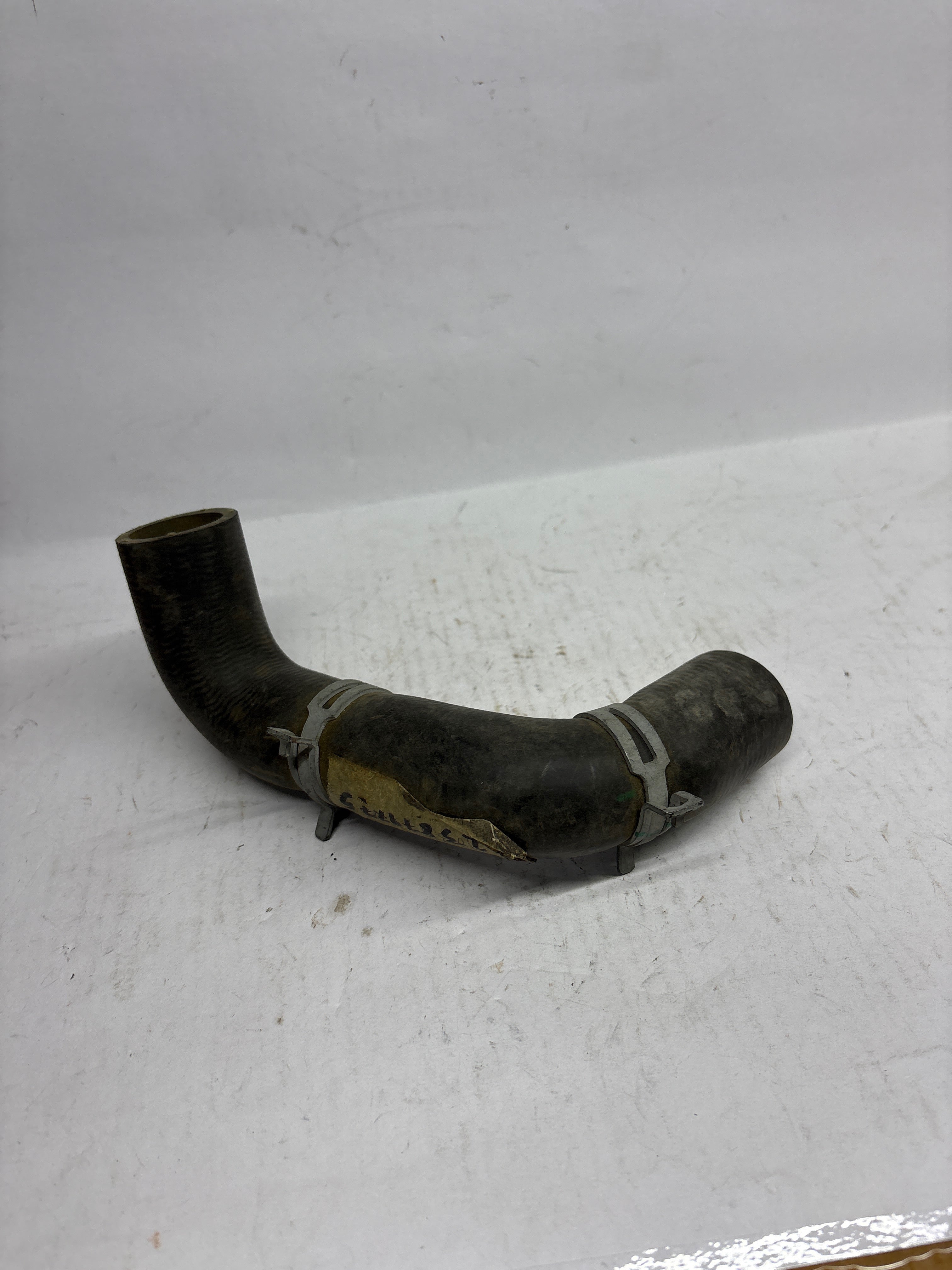 Chevrolet Pipe Assembly by CarTrends, auto spare part for Chevrolet vehicles, shown in black metal with connectors and fittings.