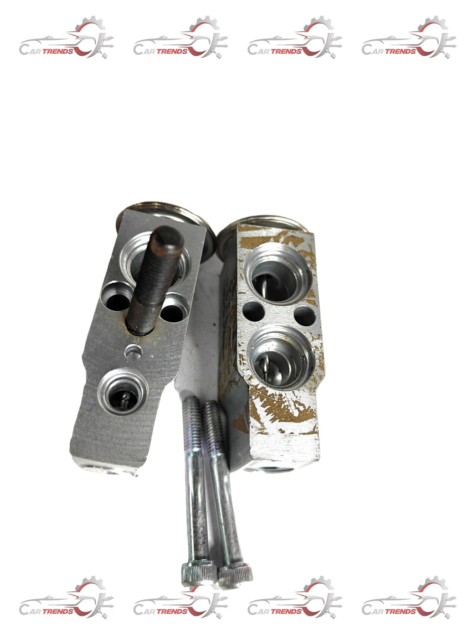 CarTrends expansion valve for Tavera, spare auto part, with metallic body and connection ports, designed for vehicle cooling system.