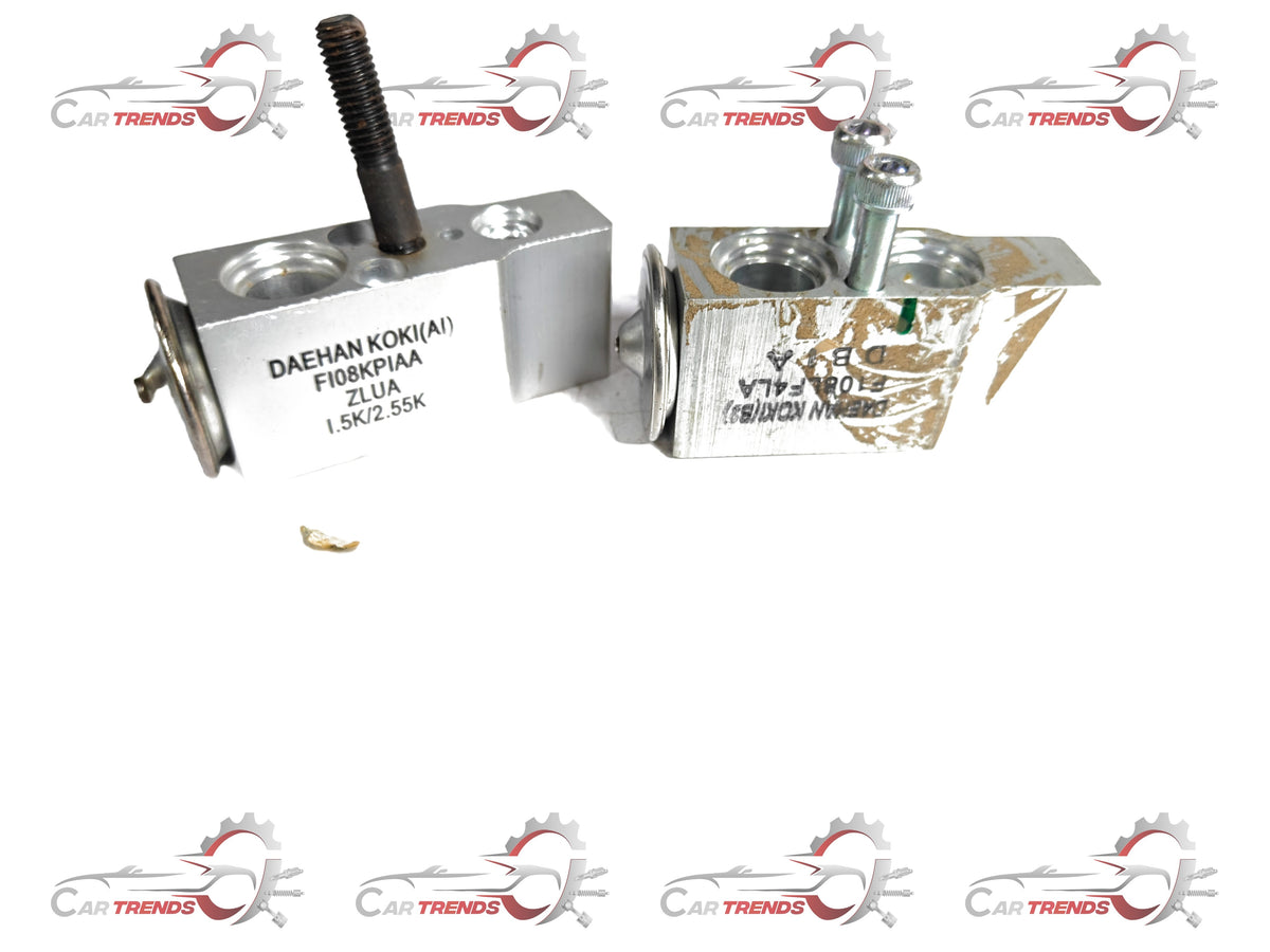CarTrends expansion valve for Tavera, automotive spare part, shown in close-up with metal fittings and valve body.