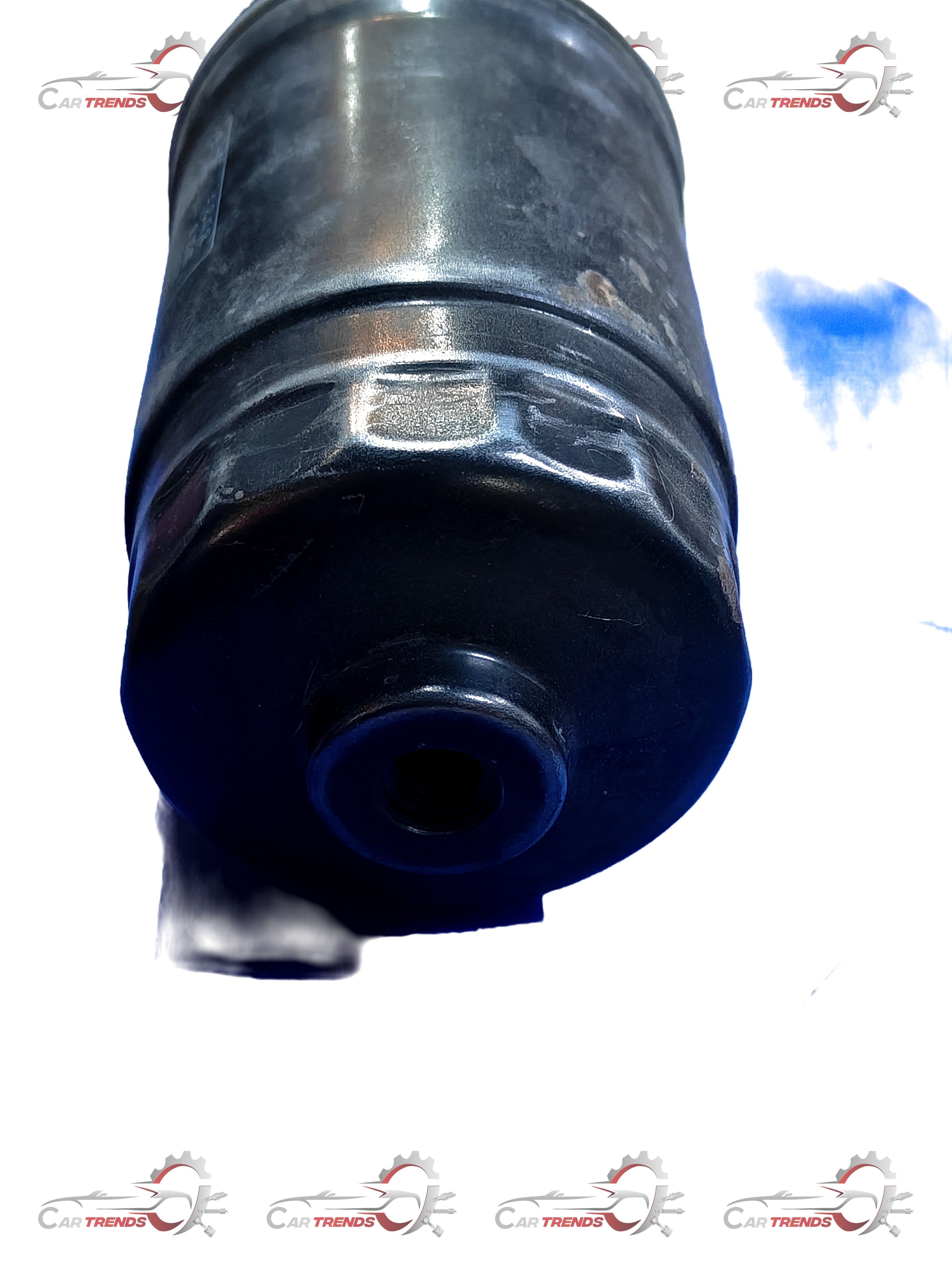 CarTrends fuel filter for Creta, spare part 319222E900, shown in the image with a cylindrical metal design and inlet/outlet ports.