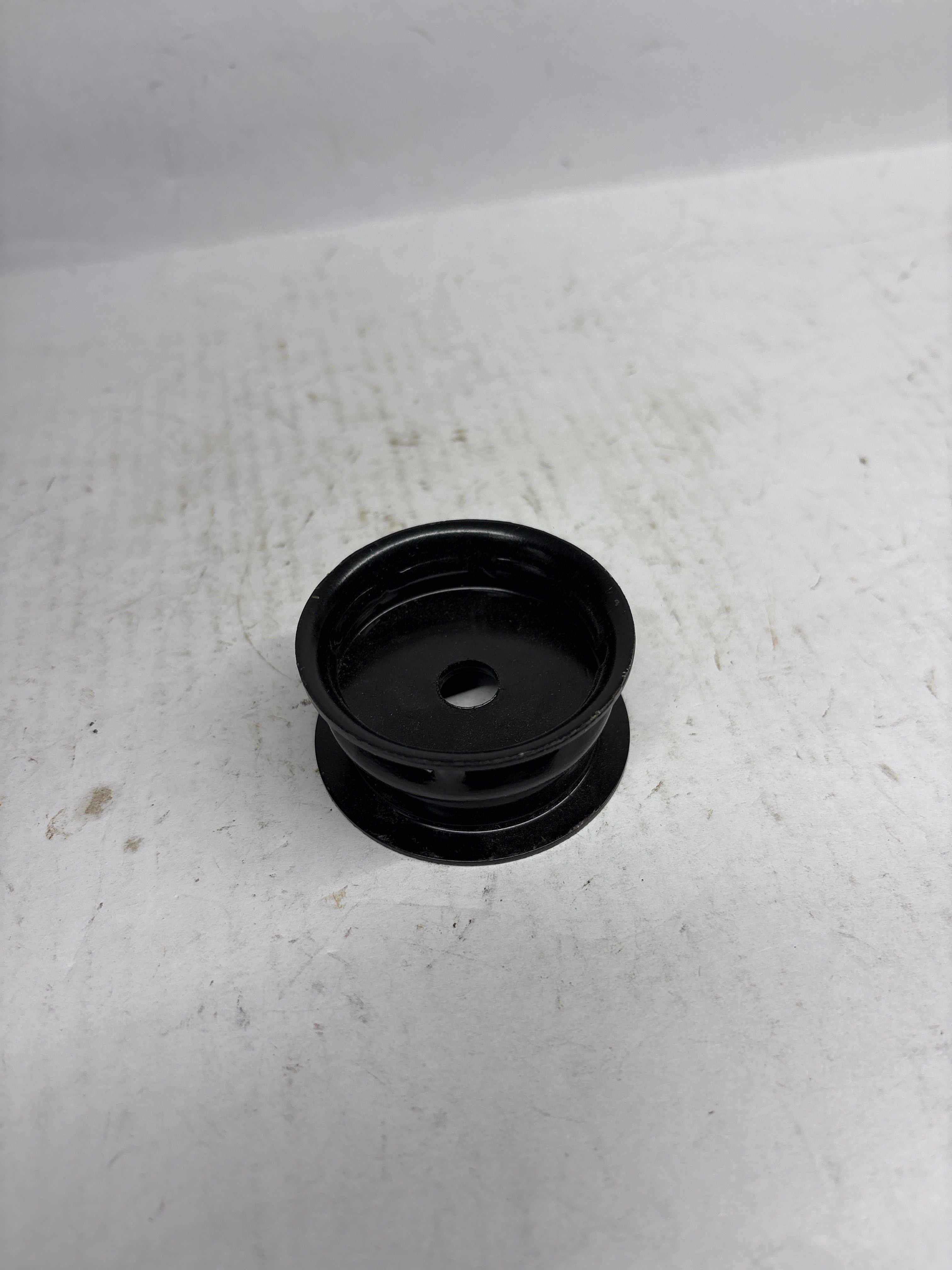 CarTrends rear ABS washer beat, spare car part, close-up view of the white plastic washer used in vehicle brake systems