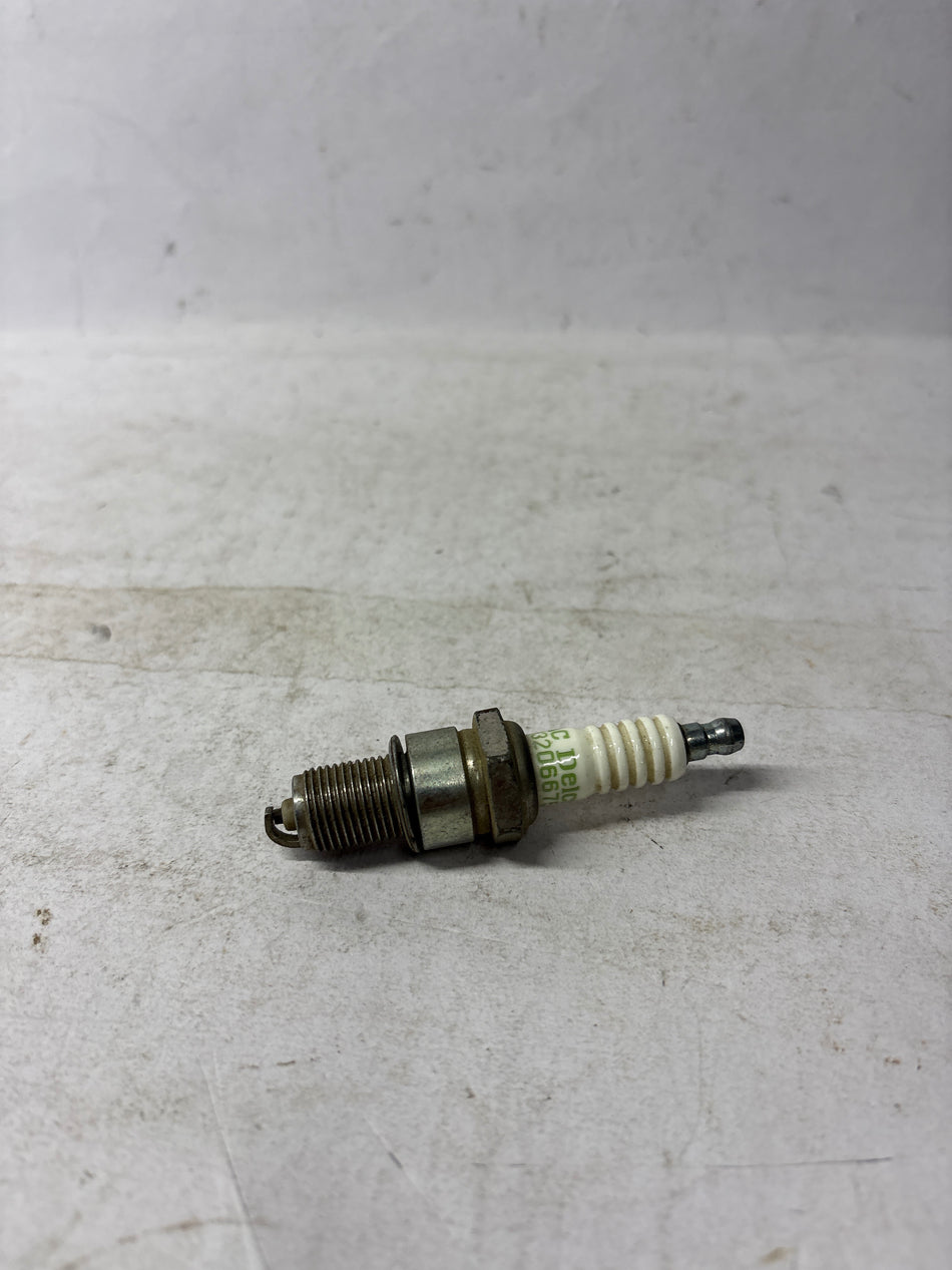 CarTrends Spark Plug Corsa spare part, showing the metallic and ceramic components of the ignition spark plug.