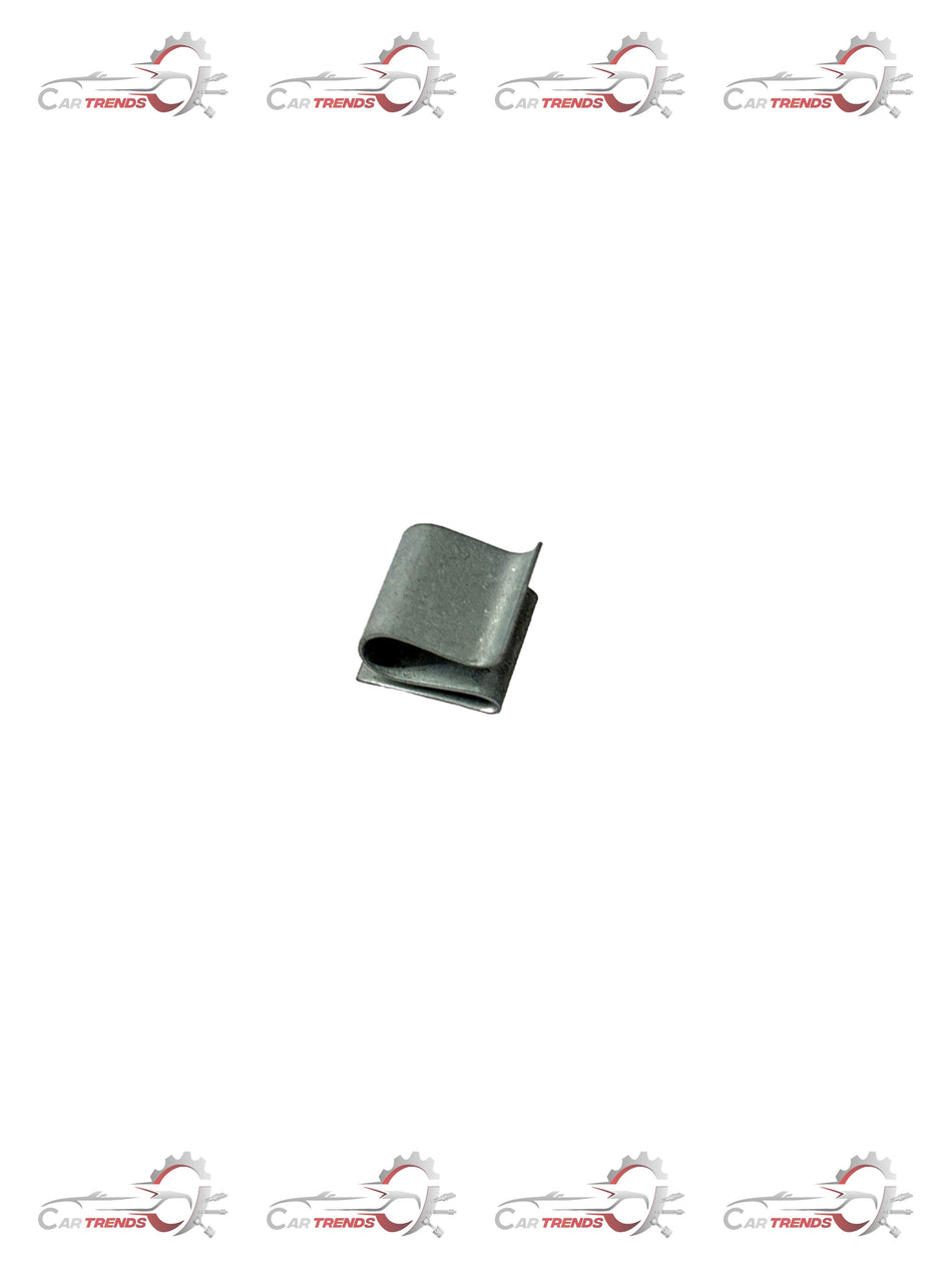 CarTrends T94116002 door pad clip for Tavera, close-up of black plastic spare part for car interior repair.