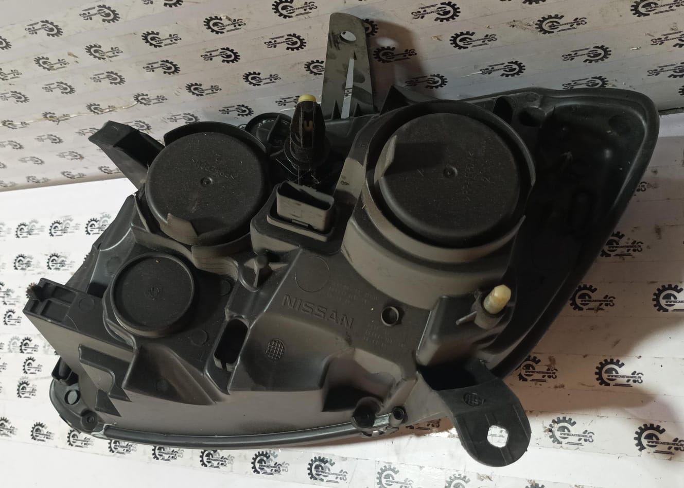 Nissan Terrano head lamp right side spare part by CarTrends, showing the automotive headlight component for the vehicle.