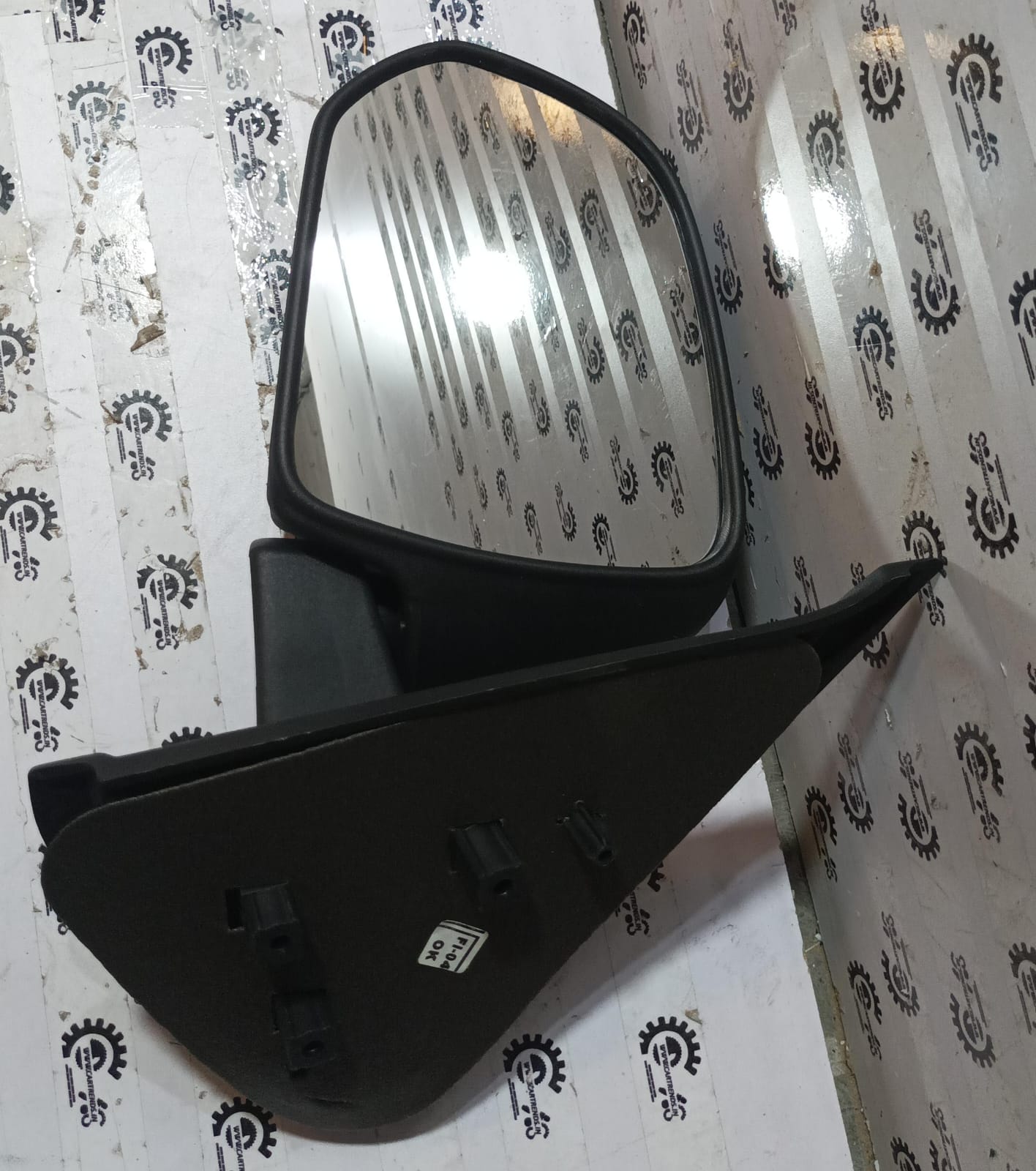 Left door mirror assembly for Datsun Go by CarTrends, Nissan spare part, showing the mirror housing and mounting details.