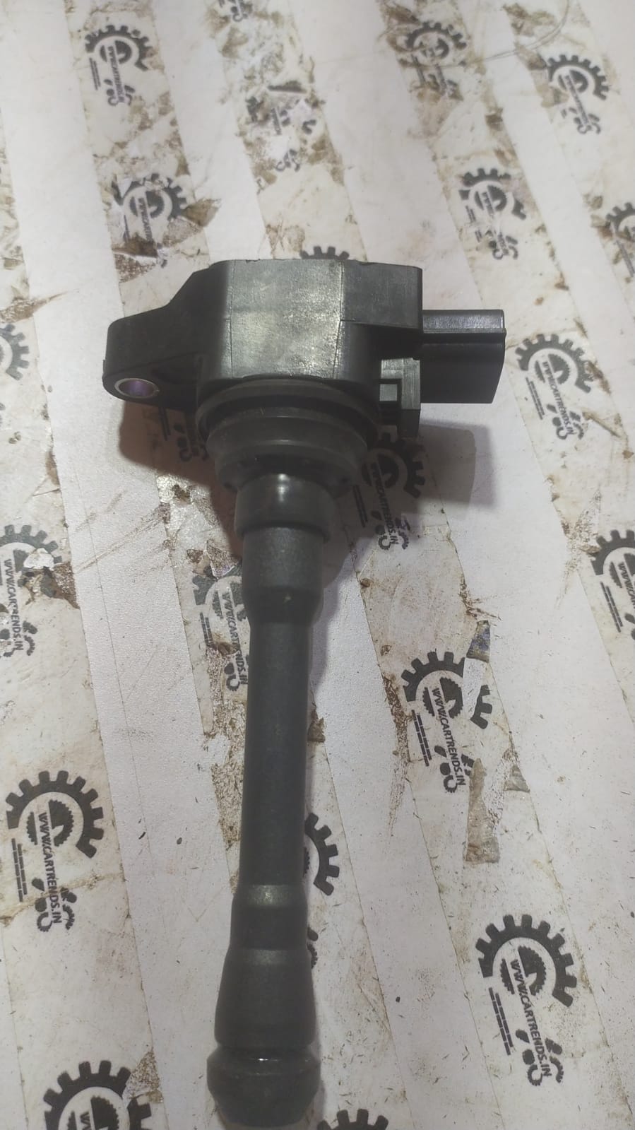 Renault Kwid ignition coil from CarTrends, spare part for vehicle ignition system, shown in the image.