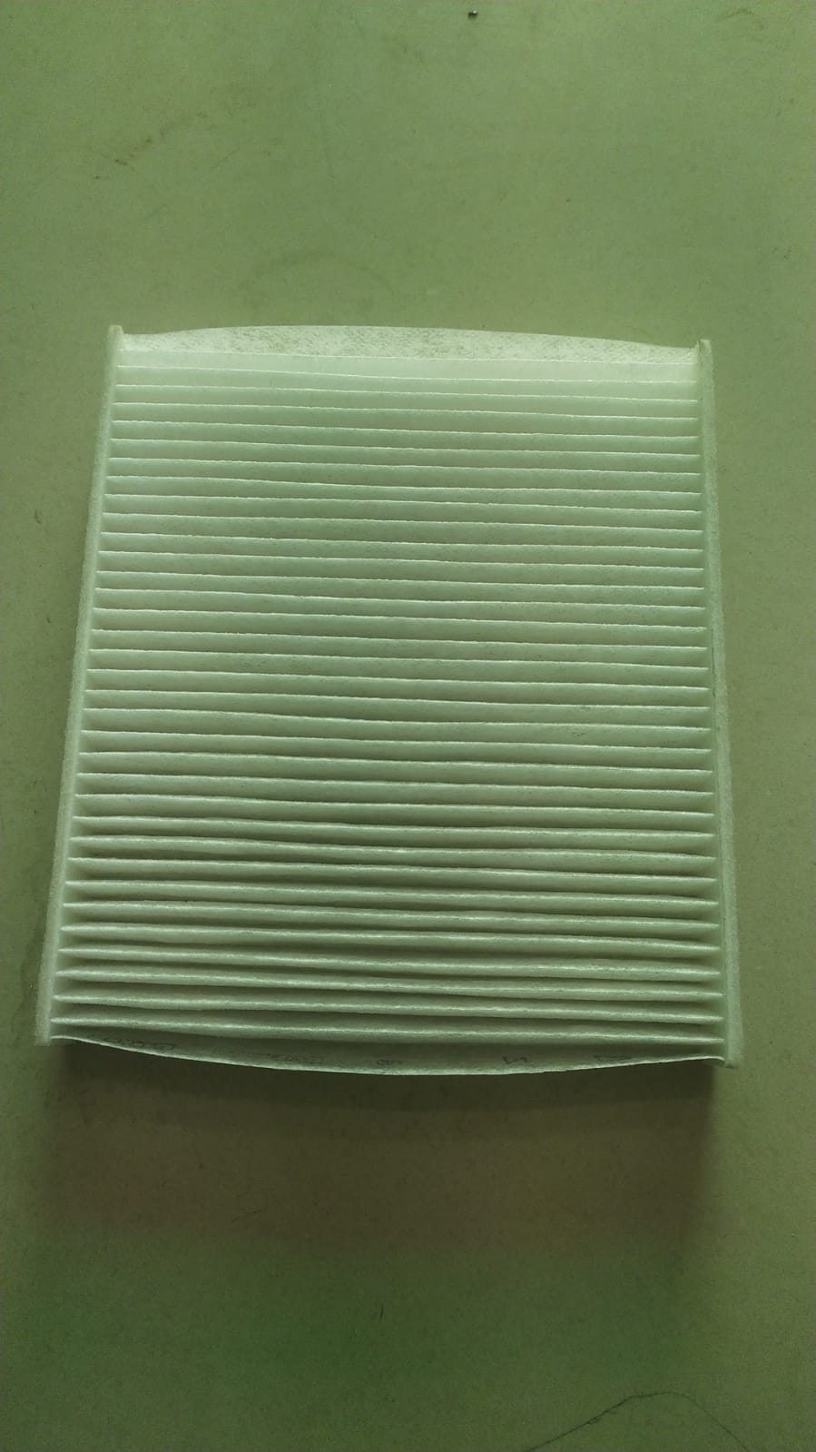 Toyota Fortuner 2nd Gen interior air filter by CarTrends, showing the replacement cabin filter with product code 871390K050.
