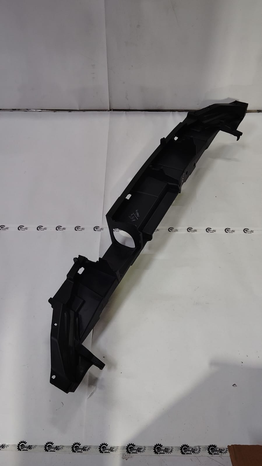 Ford front bumper bracket GN1Z17C897B, automotive replacement part, shown in black with mounting points and structural design.