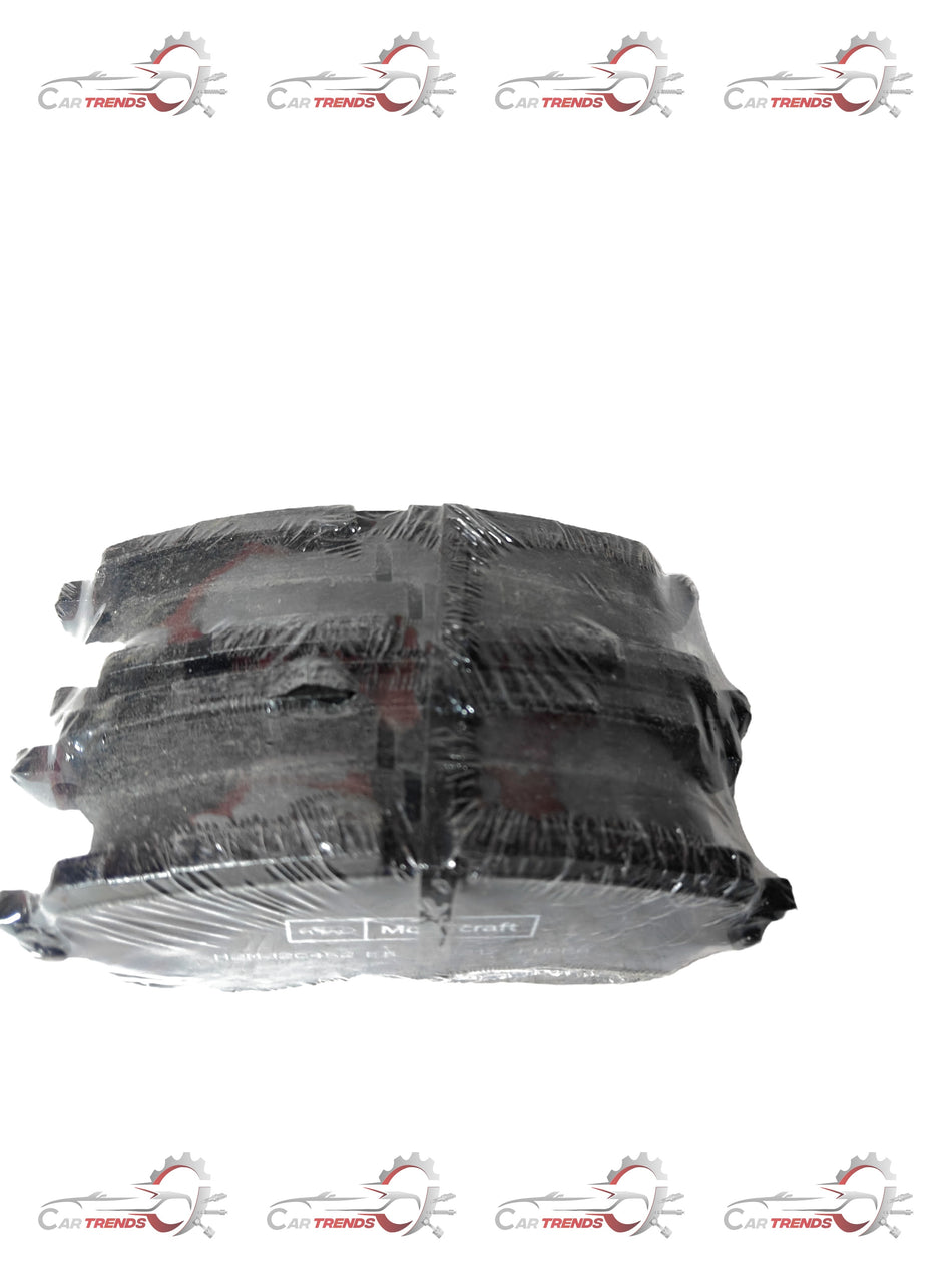 Front Ford EcoSport brake pad, model H2MZ2V001E, showing the new brake pad with metal backing and friction surface.