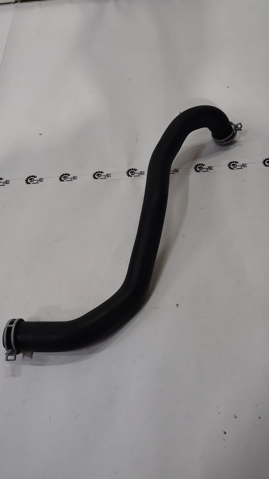 Ford hose assembly for Fiesta, model #8V218B273BC, showing a close-up of the black rubber hose pipe with fittings.
