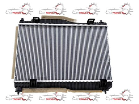 Ford radiator 8V5Z8005B with metal fins and hoses, visible for cooling system replacement in a Ford vehicle.