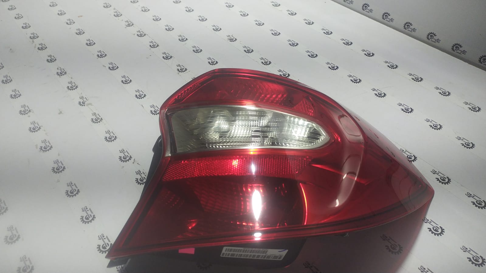 Ford Figo Aspire right tail lamp E4BZ132K24C, new replacement part with clear lens and mounting features.