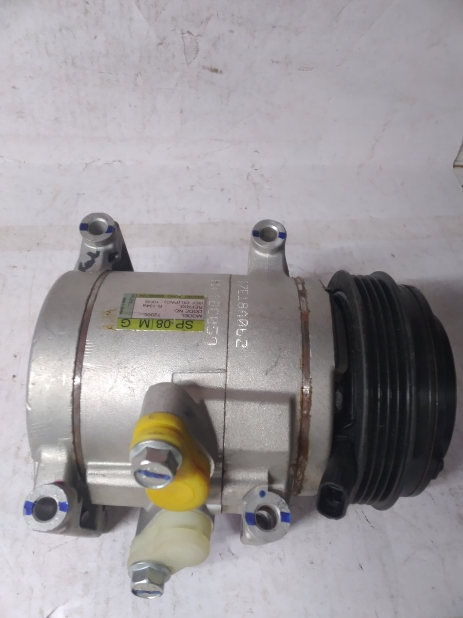 GENERAL MOTORS AC compressor Spark J96858724, automotive part with metal casing and fittings, designed for vehicle air conditioning systems.