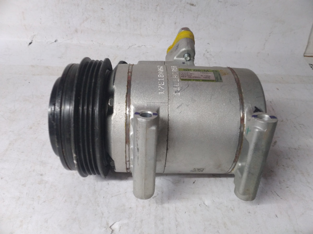 General Motors AC compressor Spark J96858724, automotive part for vehicle air conditioning system, shown in the image.