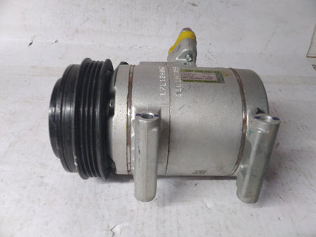 General Motors AC compressor Spark J96858724, automotive part for vehicle air conditioning system, shown in the image.