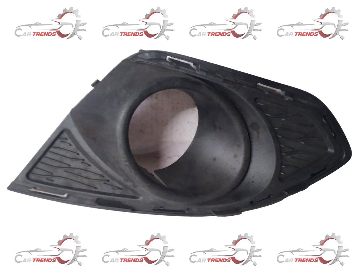 Front bezel fog light assembly for GM vehicles, branded GENERAL MOTORS, shown in a detailed close-up image.
