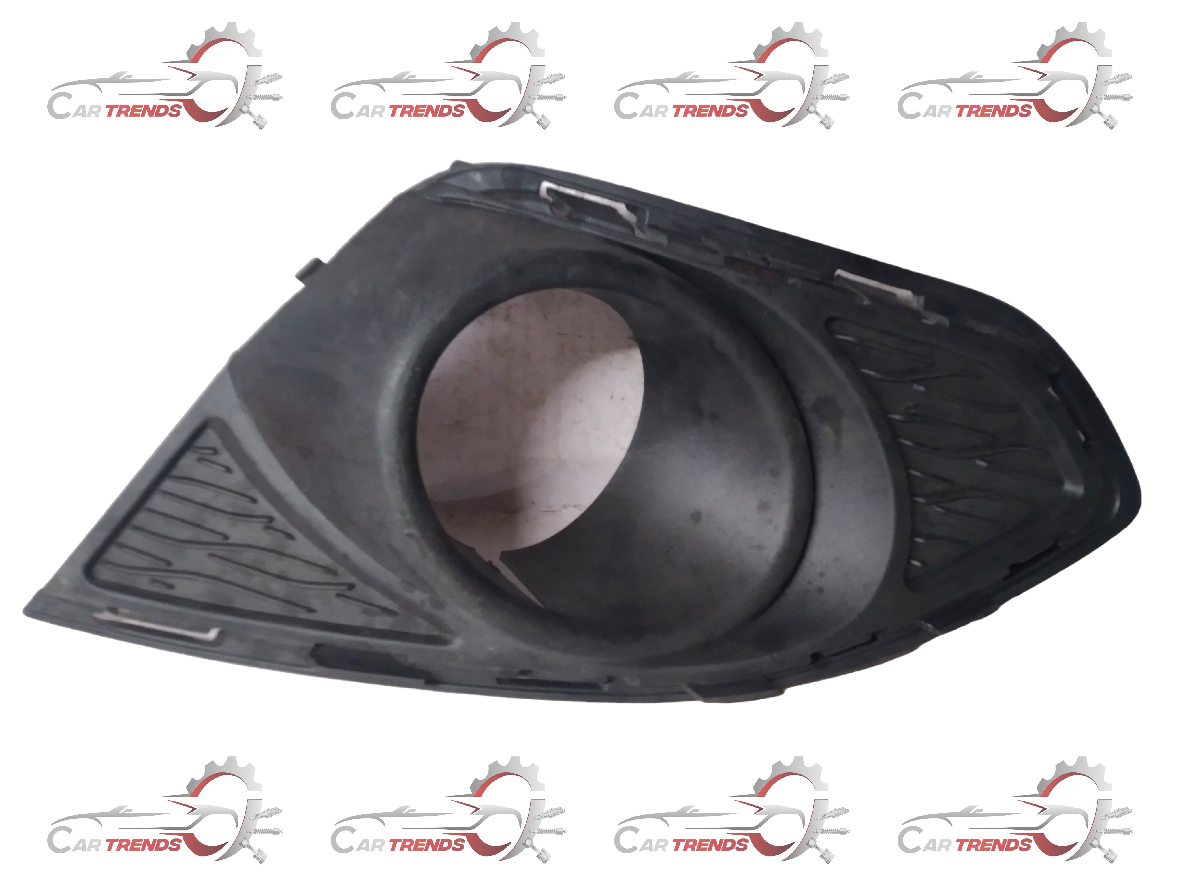 Front bezel fog light assembly for GM vehicles, branded GENERAL MOTORS, shown in a detailed close-up image.