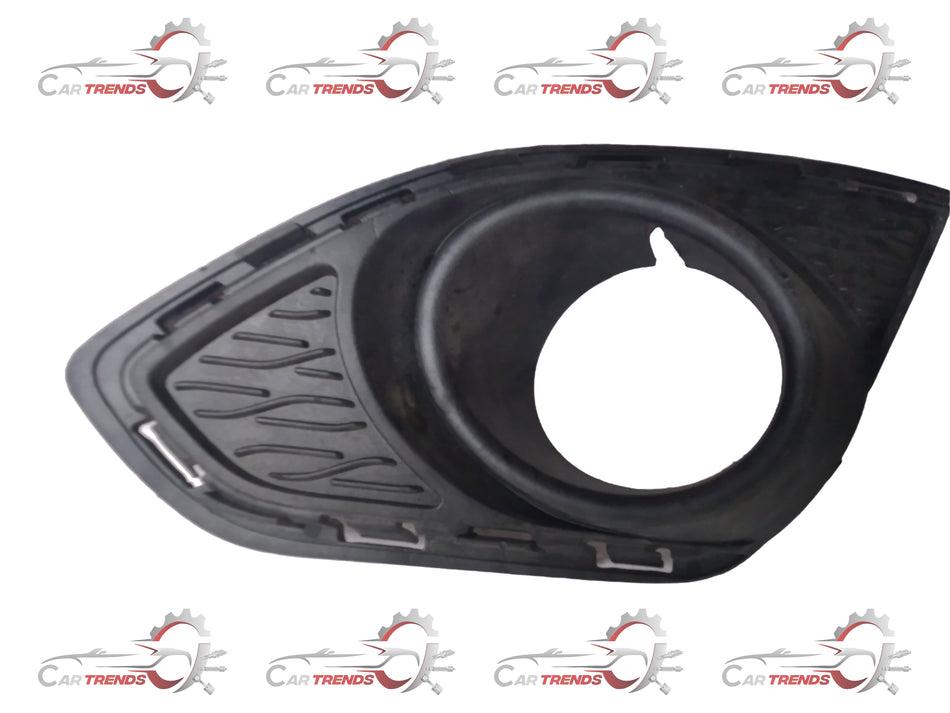 Front fog light bezel for General Motors vehicles, model J95214495, durable plastic part for vehicle front lighting.