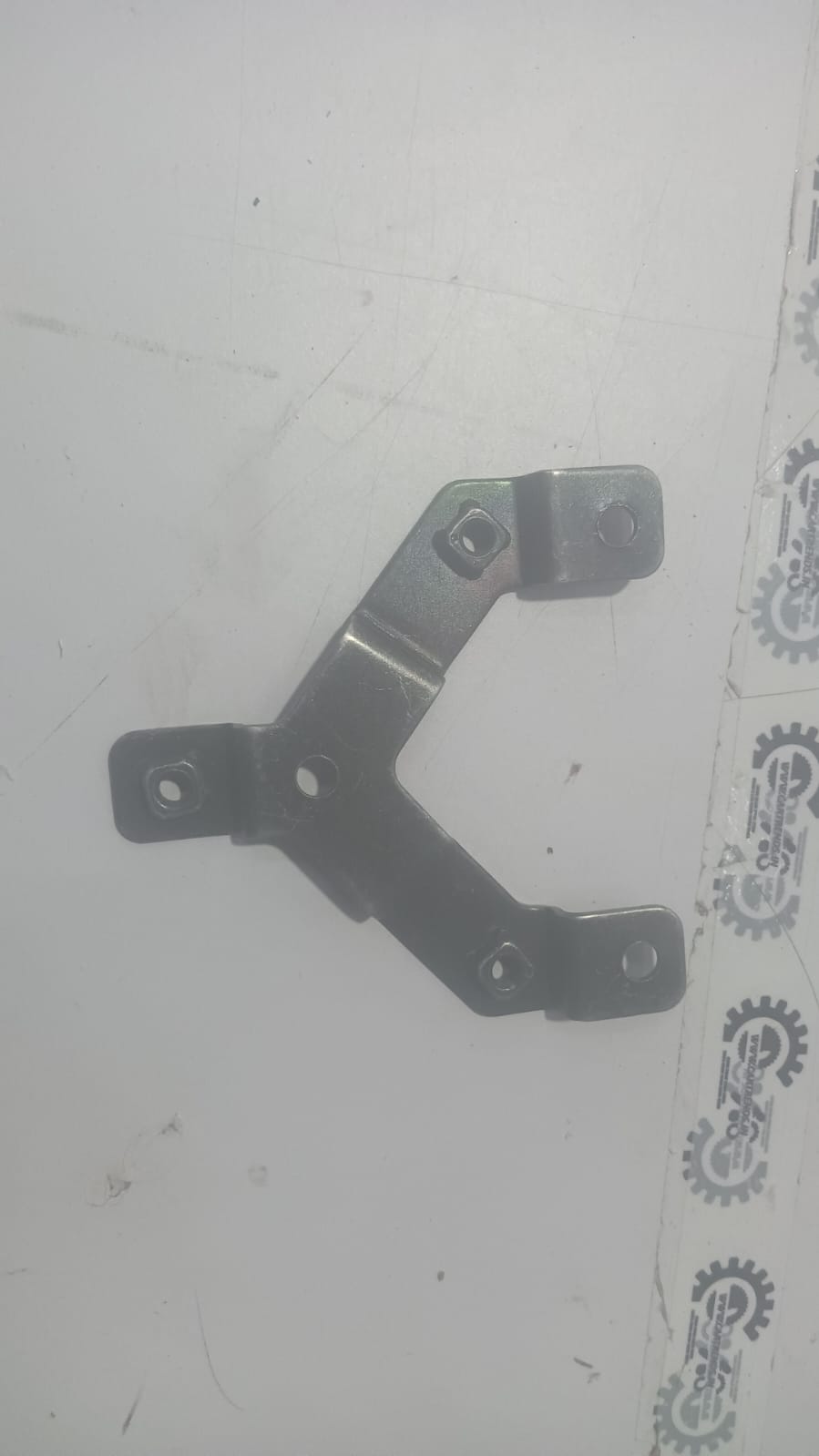 General Motors dual coil A spark bracket, automotive engine component, shown in a detailed view.