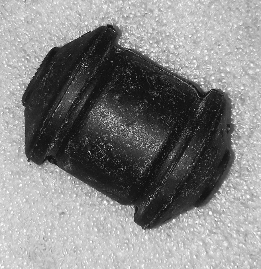 General Motors front damping C-arm for Opel Optra petrol model, showing the suspension component with bush and damping features.