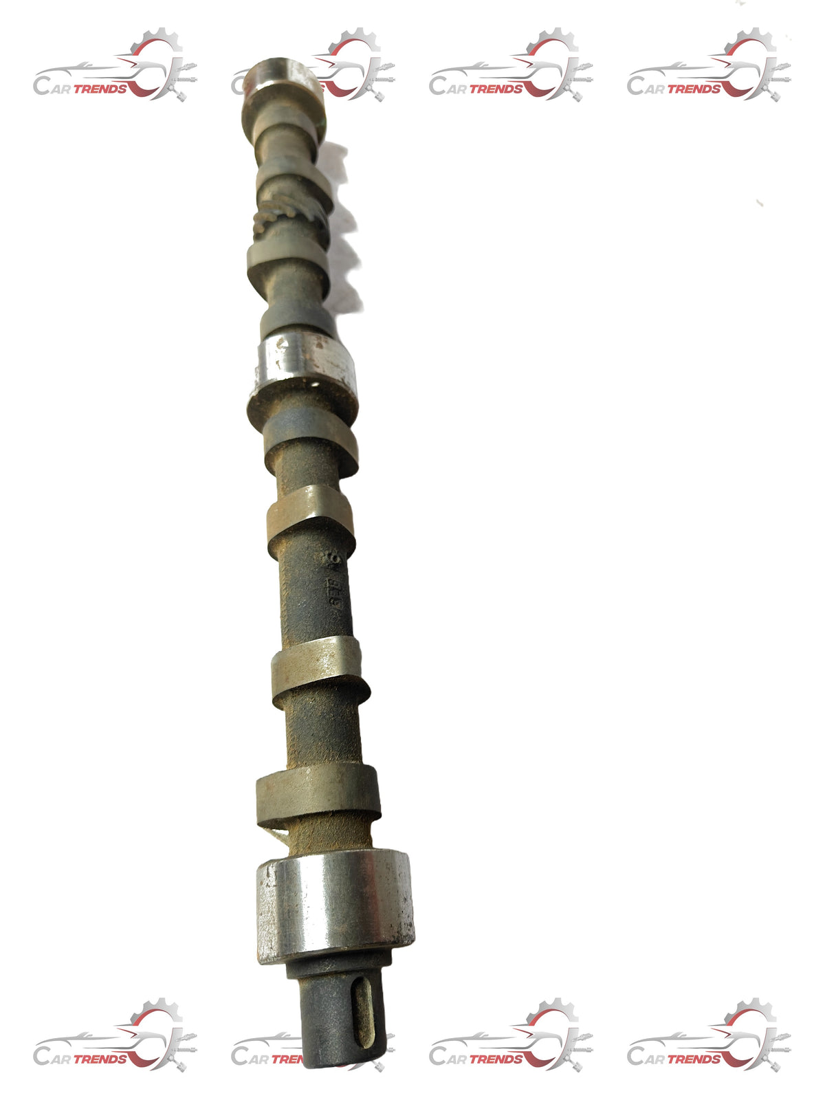 General Motors camshaft Tavera T97597480 for GM vehicles, detailed metal component with gear and lobes.