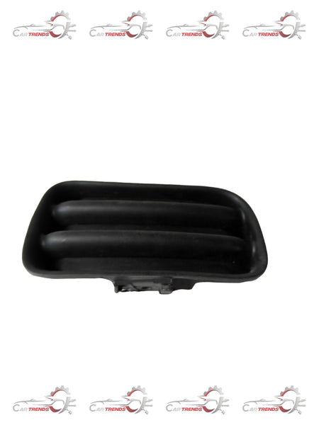 General Motors Tavera fog lamp cover hole on right side, showing the black plastic exterior and mounting details.
