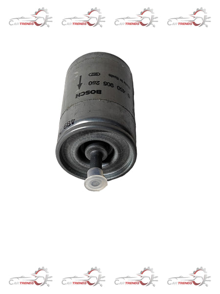 General Motors fuel filter for Astra, model 981249, showing the cylindrical filter with inlet and outlet ports.