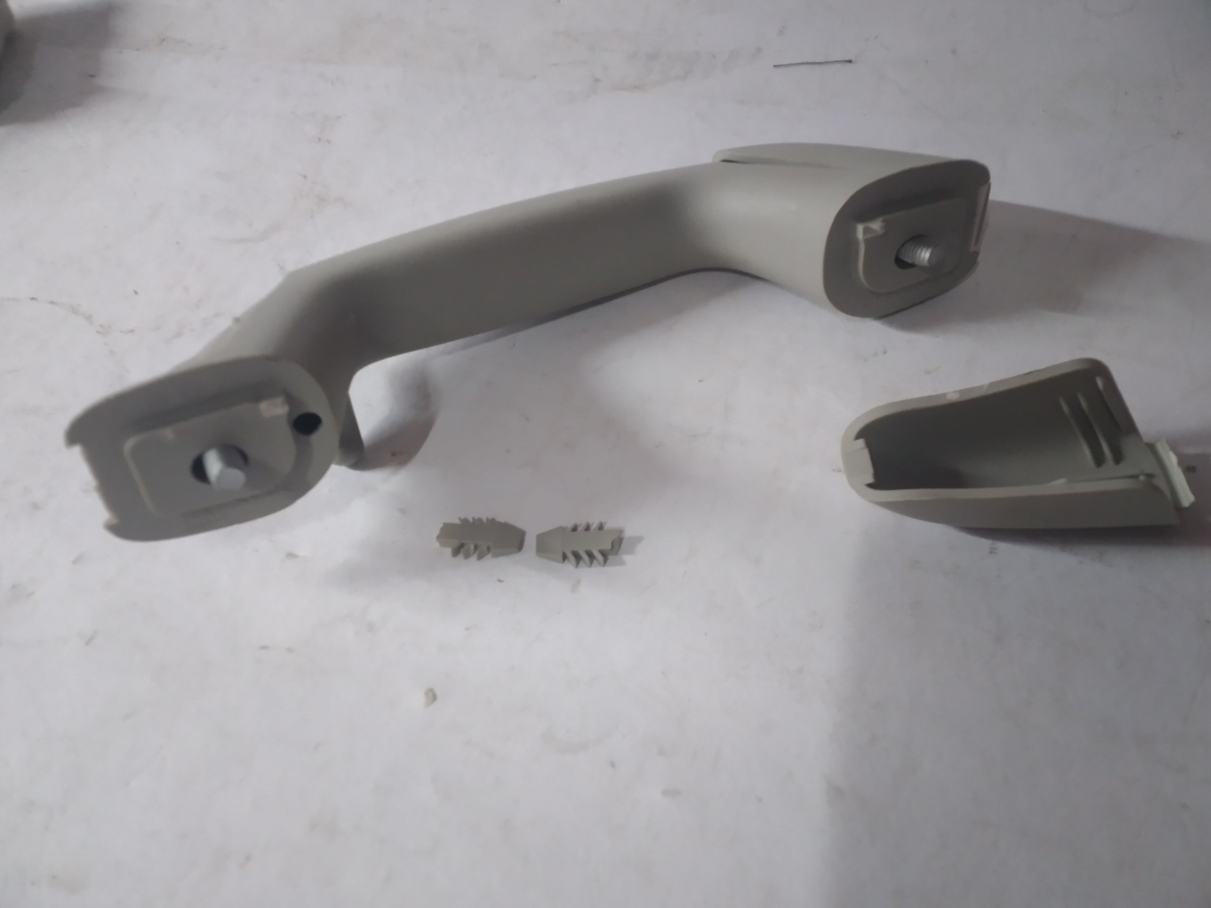 General Motors handle assembly for left-hand side, part J96909004, designed for vehicle door operation and replacement.