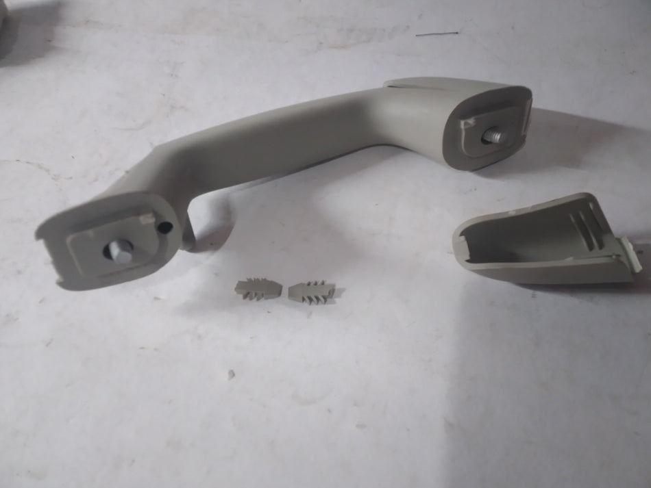 General Motors handle assembly for left-hand side, part J96909004, designed for vehicle door operation and replacement.