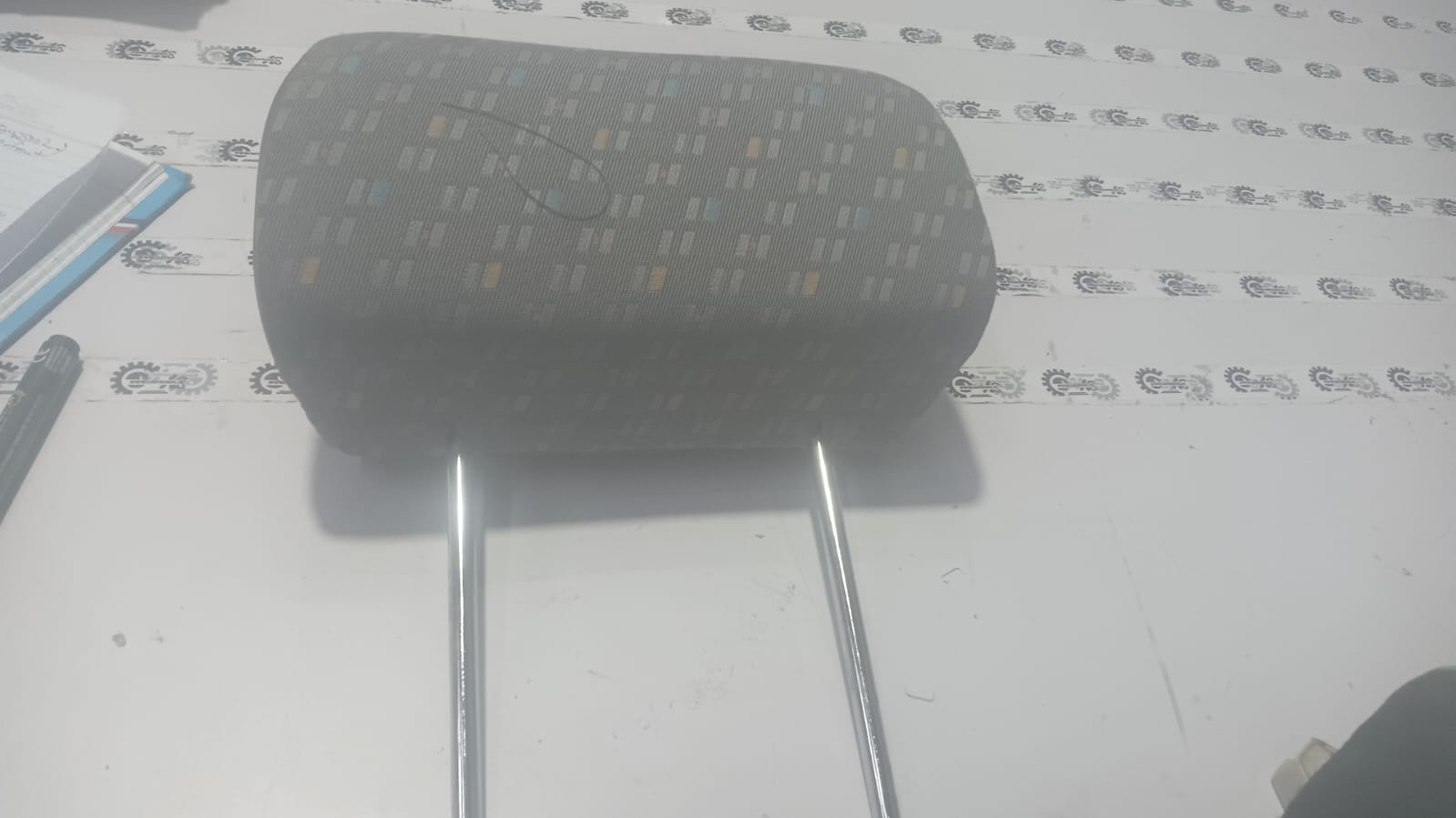 Headrest for first-generation Chevrolet Tavera interior, showing the adjustable cushion and fabric covering.