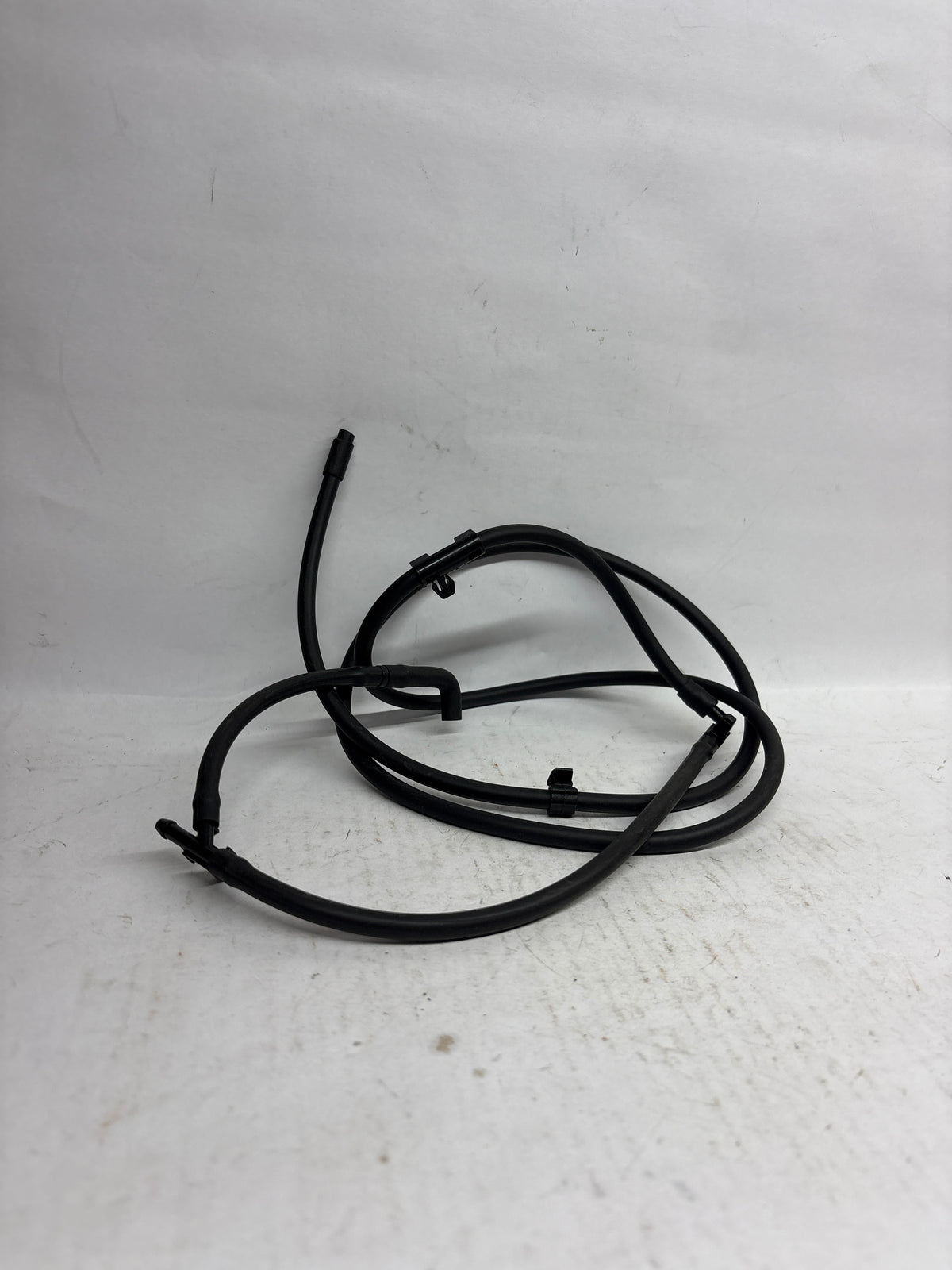 General Motors Hose A Hood for Optra Petrol, durable engine component with flexible rubber tubing for optimal performance.