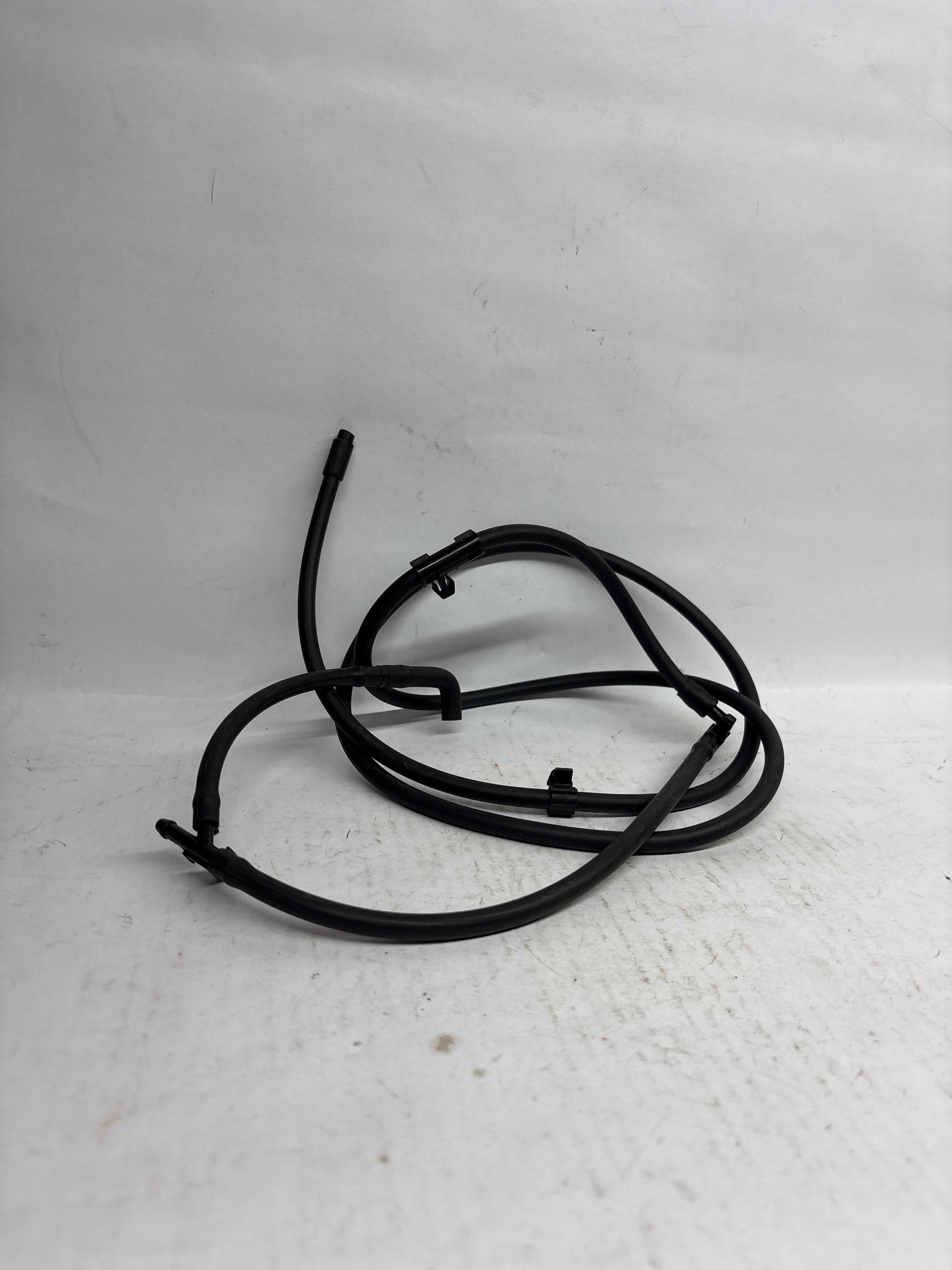 General Motors Hose A Hood for Optra Petrol, durable engine component with flexible rubber tubing for optimal performance.