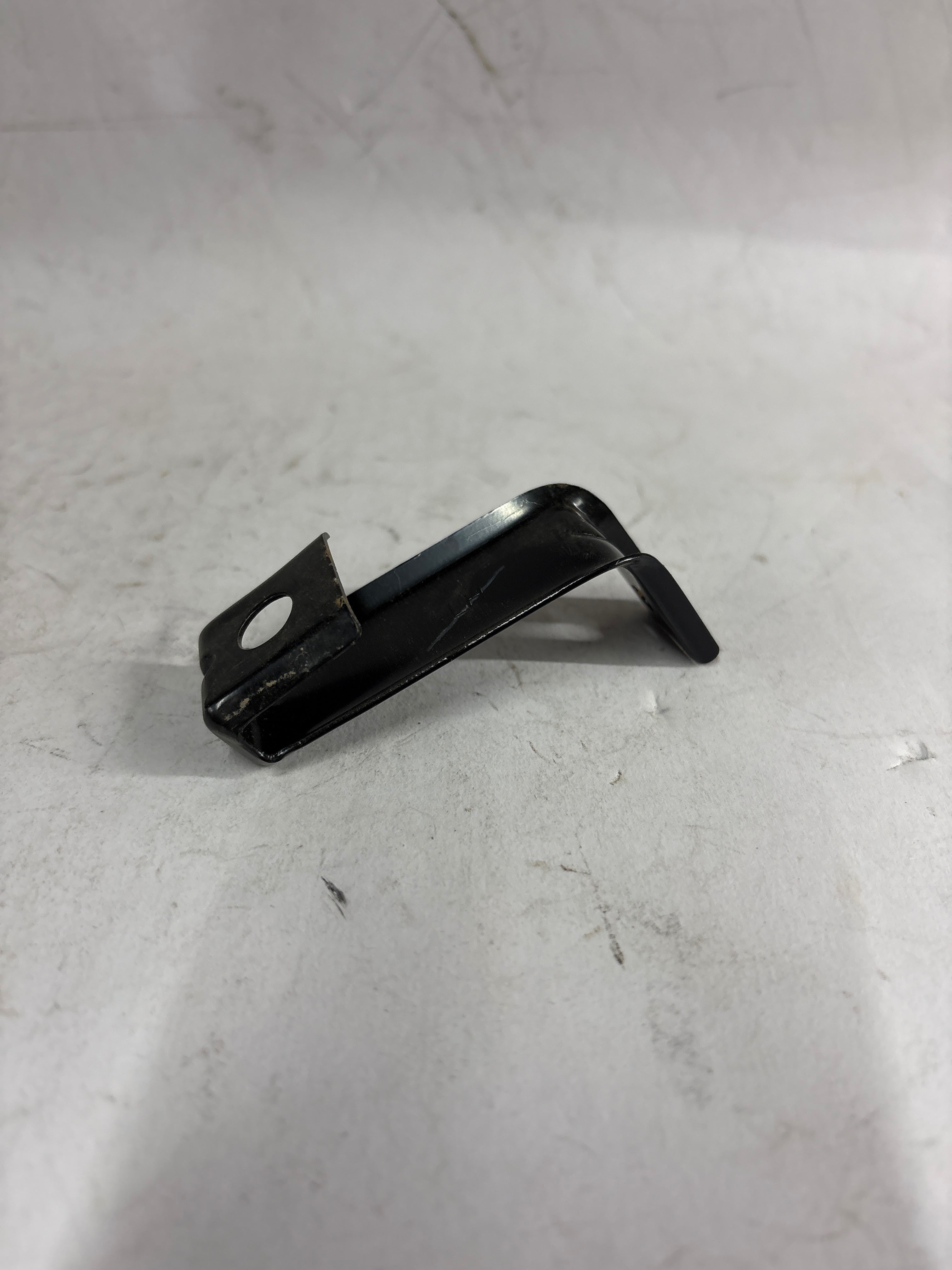 General Motors Optra front support bar, automotive part, shown in a close-up view with mounting points and metal construction.