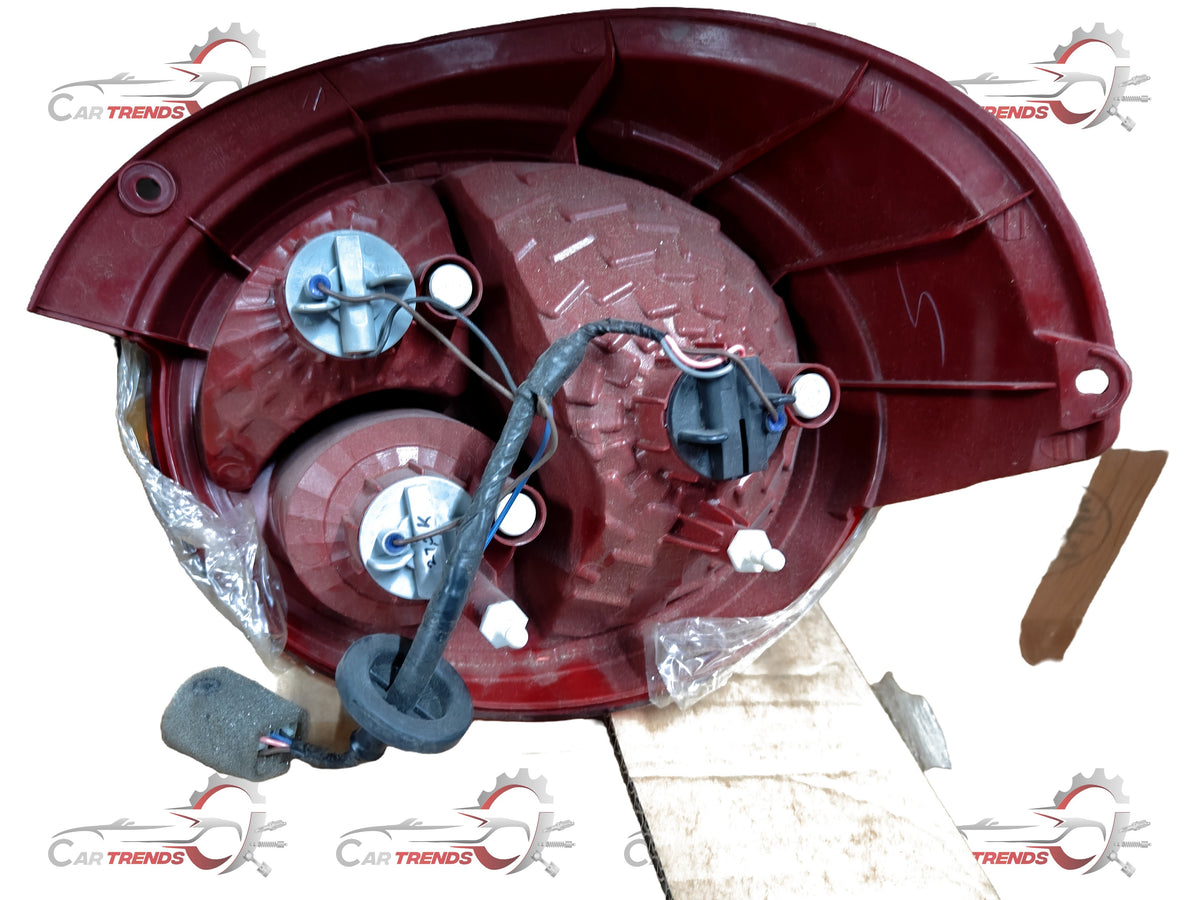 General Motors tail lamp assembly for left side, part J28291277, showing the automotive tail light with lens and mounting details.