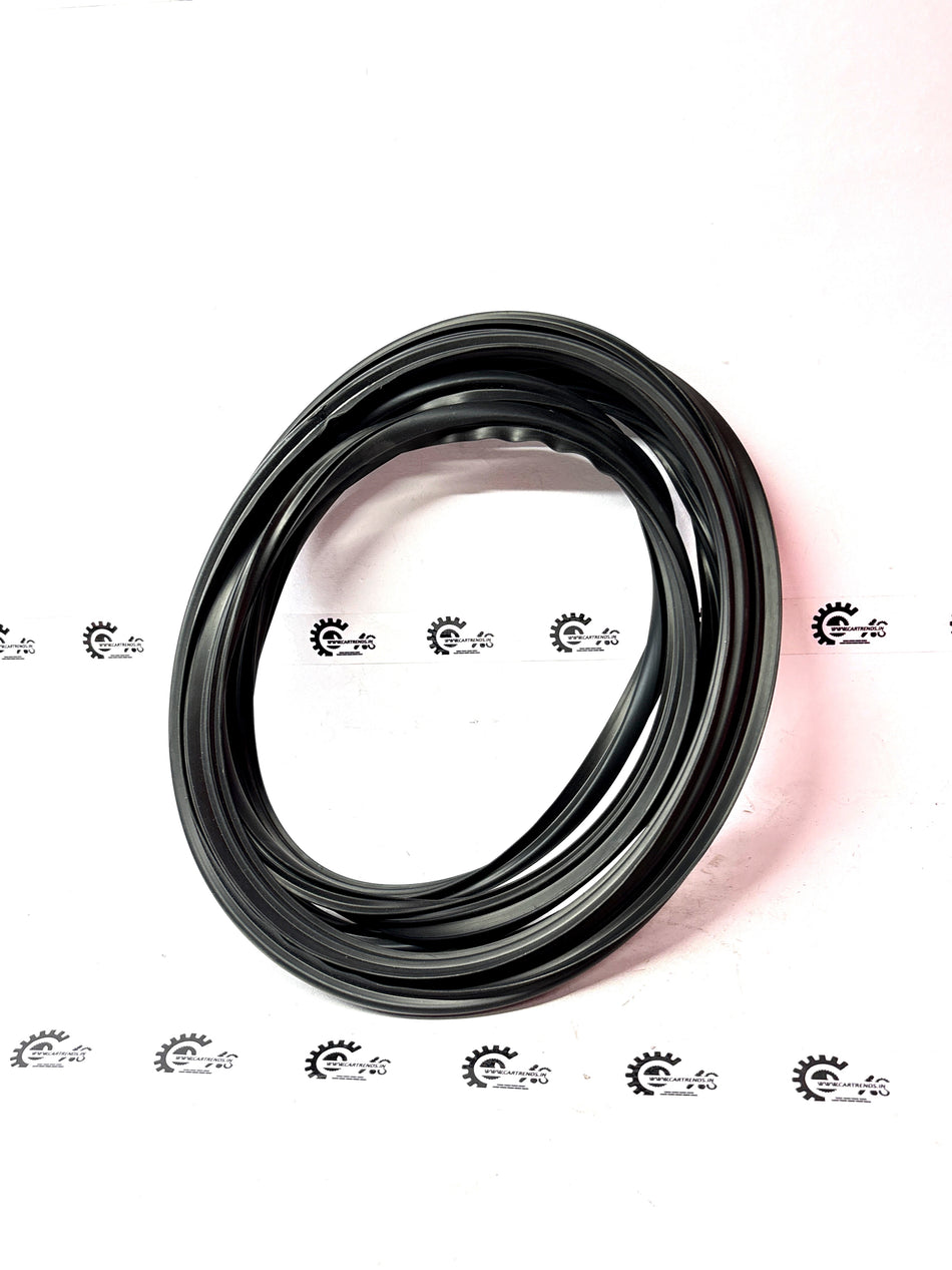 General Motors windshield molding for Aveo J981042L0, close-up of the black rubber trim fitting along the windshield edge.