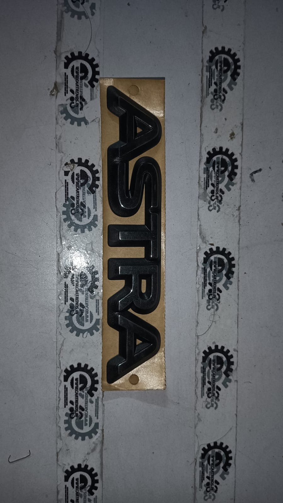 General Motors Astra name plate with model number 177618, featuring a sleek metallic design for vehicle identification.