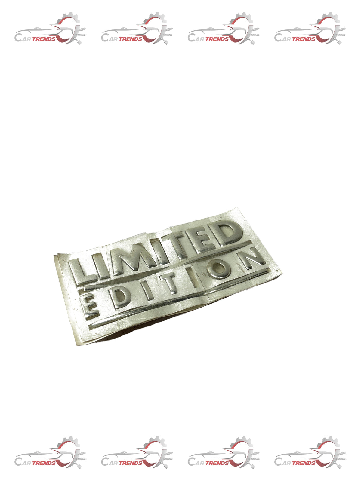Limited edition General Motors Aveo nameplate, black and silver metal car badge with model and brand details.