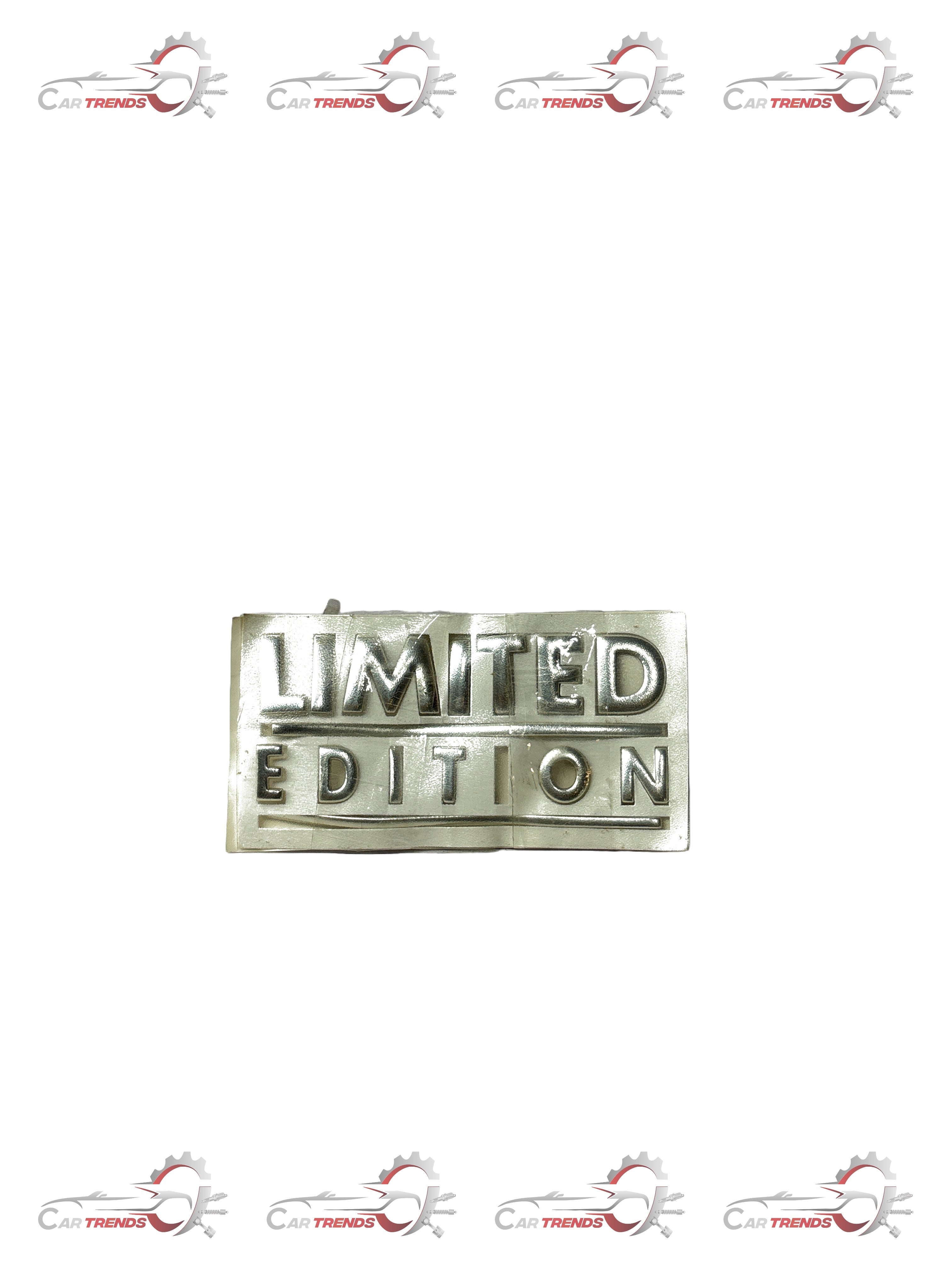 Limited edition General Motors Aveo nameplate with metallic finish, showcasing the vehicle's model and branding details.