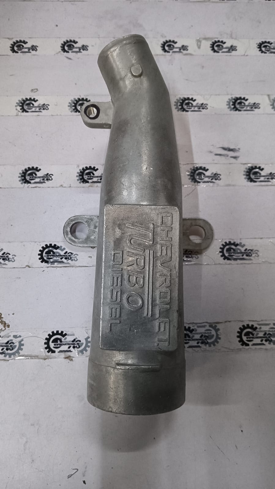 General Motors Tavera intake pipe, automotive engine part, shown in a close-up image, designed for vehicle airflow and engine performance.