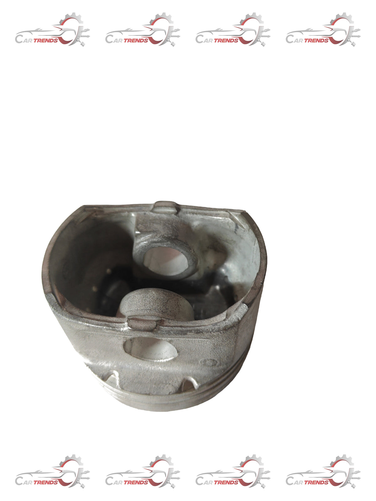 General Motors Aveo piston part J93740421, close-up view showing the metal piston with detailed surface features.