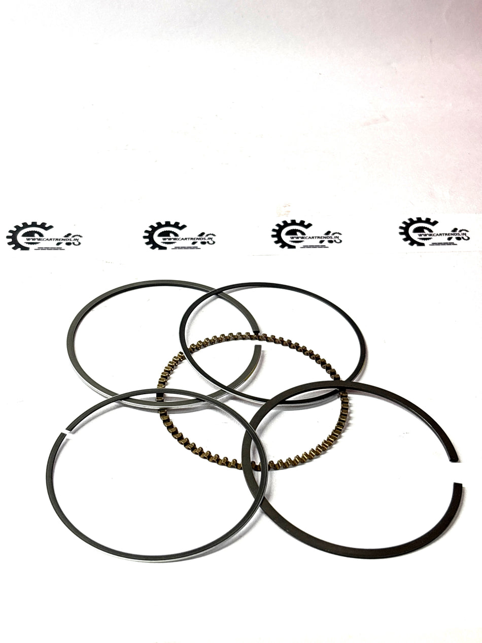 General Motors piston ring kit Beat J93745804 showing assembled metal rings for engine repair.