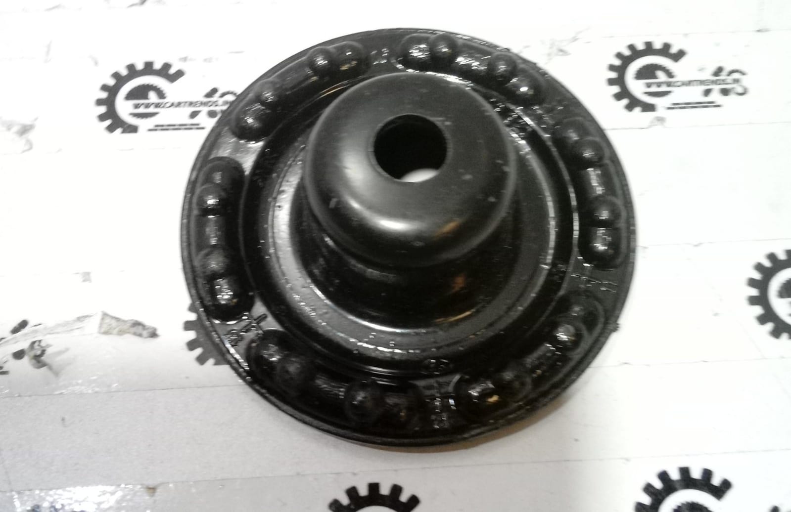 General Motors Optra petrol bumper strut mount plate, OEM part J96549920, visible in the image.